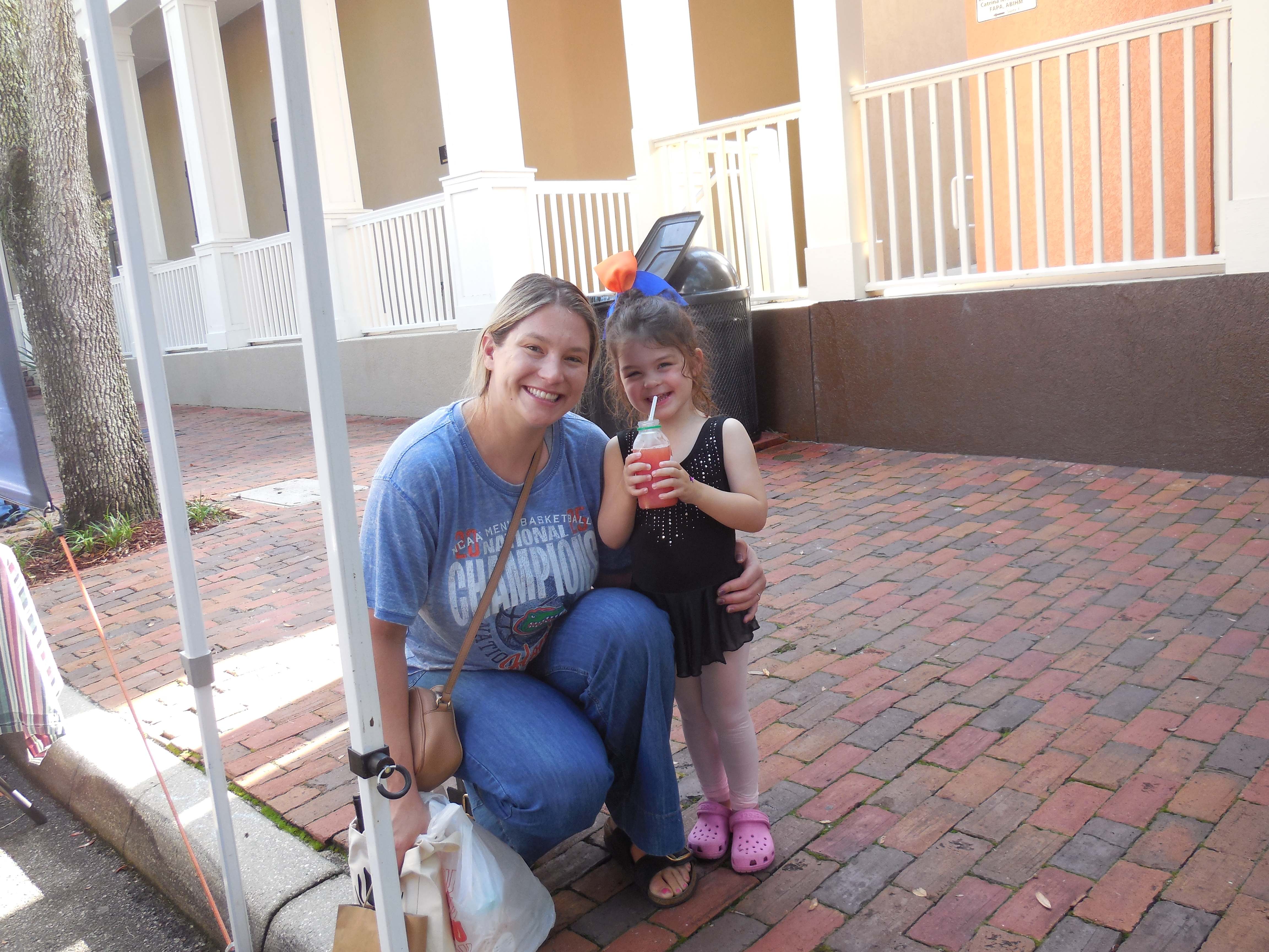 Happy mother and daughter enjoying Life in a Bottle juice